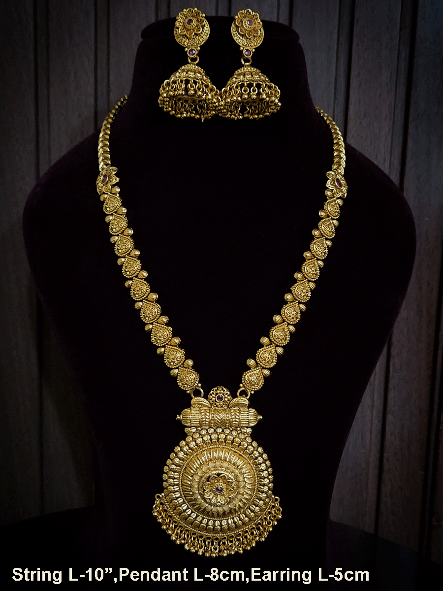 Circular pendant with ruby stone flower in center 10" long leaf design string set