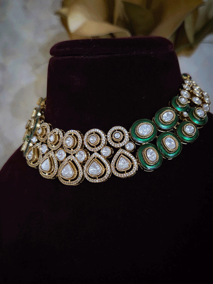 Uncut polki and moissanite studded classy set with green enamel detailing on both sides