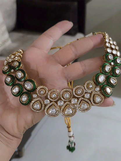 Uncut polki and moissanite studded classy set with green enamel detailing on both sides