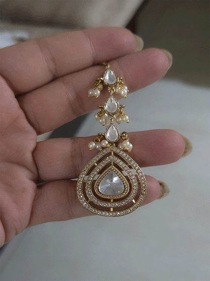 Uncut polki and moissanite studded classy set with green enamel detailing on both sides