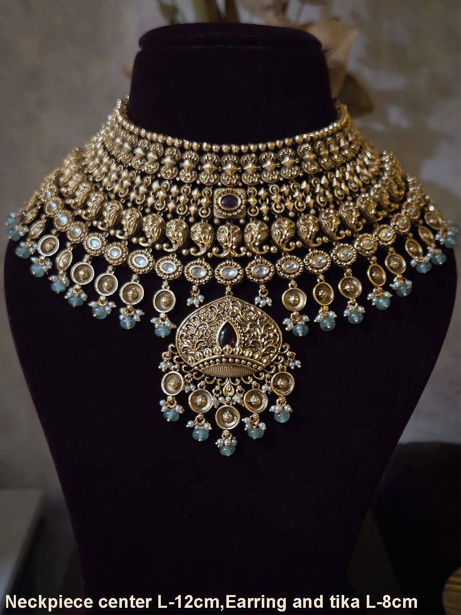 Intricately carved 12cm broad paisley design kundan set with coloured drops and ruby stone leaf design center
