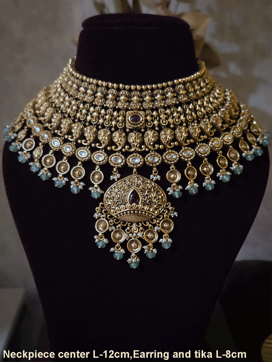 Intricately carved 12cm broad paisley design kundan set with coloured drops and ruby stone leaf design center