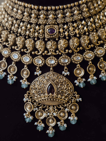 Intricately carved 12cm broad paisley design kundan set with coloured drops and ruby stone leaf design center