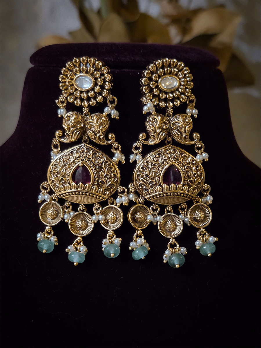 Intricately carved 12cm broad paisley design kundan set with coloured drops and ruby stone leaf design center