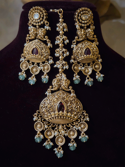 Intricately carved 12cm broad paisley design kundan set with coloured drops and ruby stone leaf design center