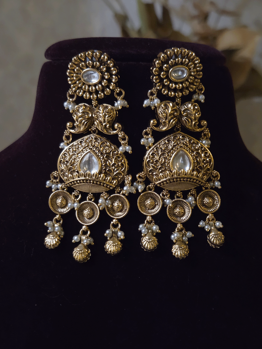 Intricately carved 12cm broad paisley design kundan set with coloured drops and ruby stone leaf design center