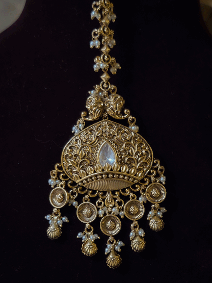 Intricately carved 12cm broad paisley design kundan set with coloured drops and ruby stone leaf design center