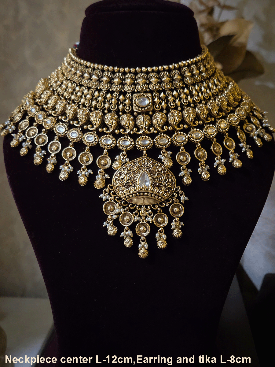 Intricately carved 12cm broad paisley design kundan set with coloured drops and ruby stone leaf design center