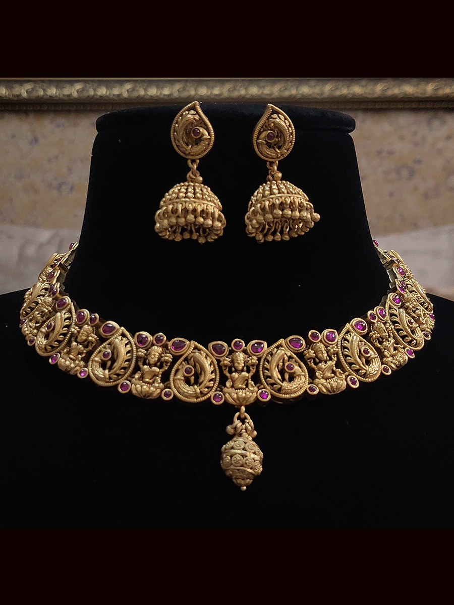 Laxmiji and peacock motif's ruby stones studded set with gold bead drop in center