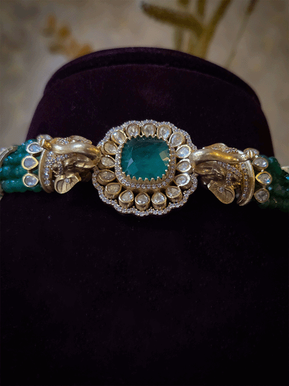 Elephant faces on sides of coloured stone in center of moissanite tukdi four bead strings set