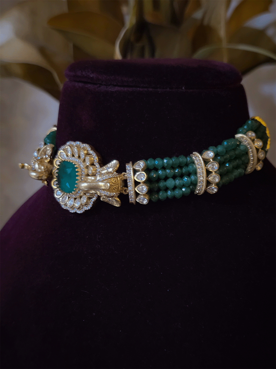Elephant faces on sides of coloured stone in center of moissanite tukdi four bead strings set