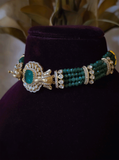 Elephant faces on sides of coloured stone in center of moissanite tukdi four bead strings set