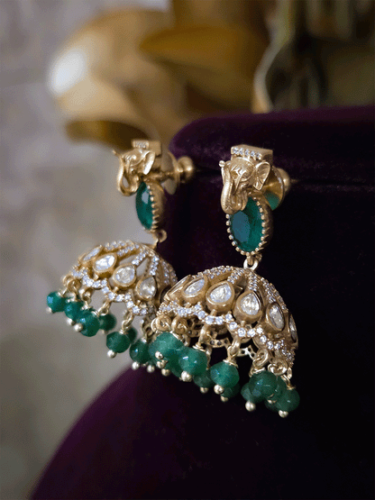 Elephant faces on sides of coloured stone in center of moissanite tukdi four bead strings set