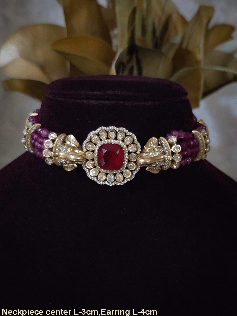 Elephant faces on sides of coloured stone in center of moissanite tukdi four bead strings set