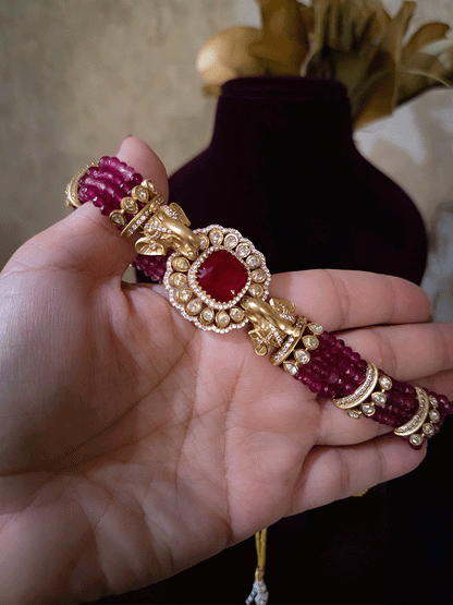 Elephant faces on sides of coloured stone in center of moissanite tukdi four bead strings set