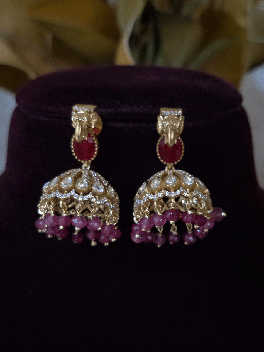 Elephant faces on sides of coloured stone in center of moissanite tukdi four bead strings set