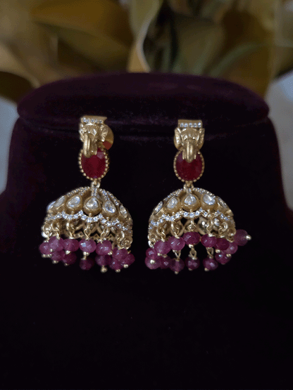Elephant faces on sides of coloured stone in center of moissanite tukdi four bead strings set