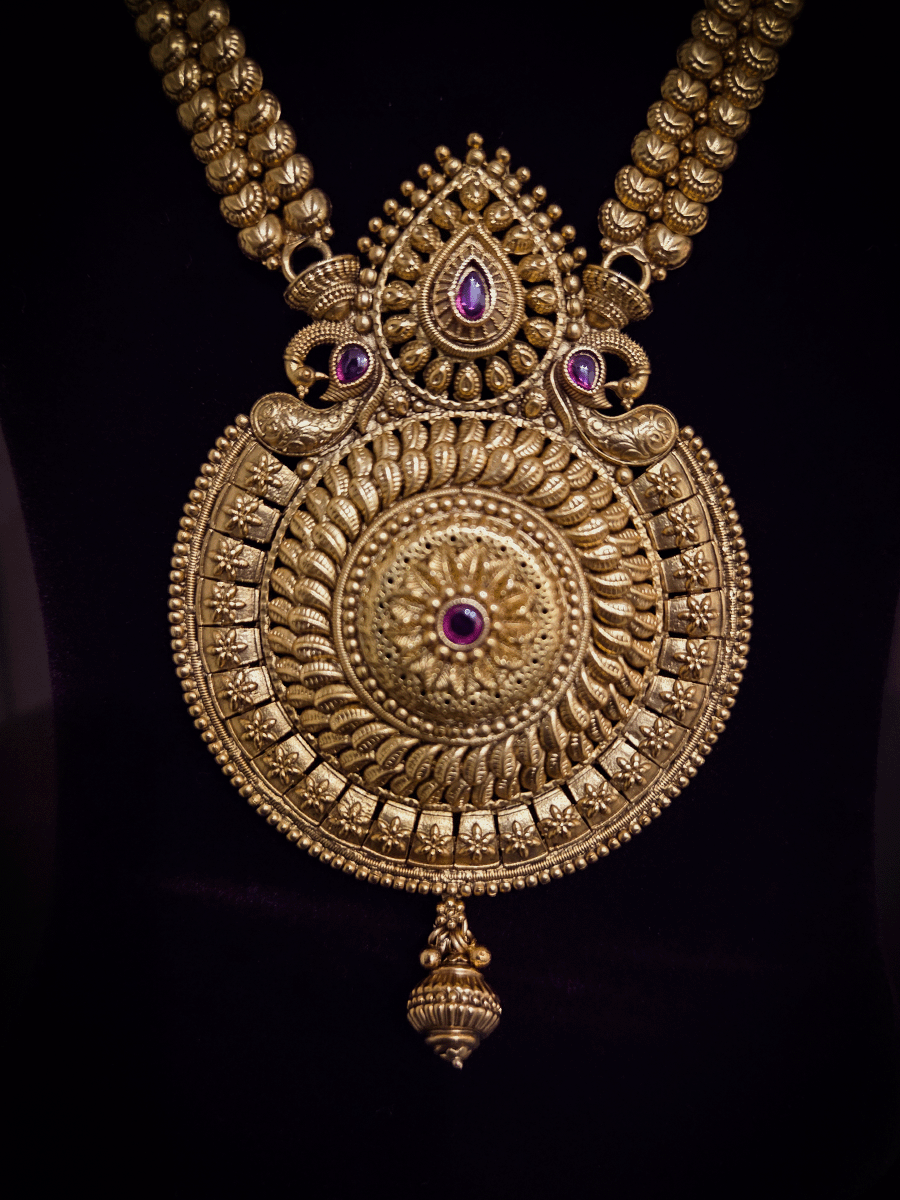 Circular pendant with paisley and ruby stone leaf top design long set