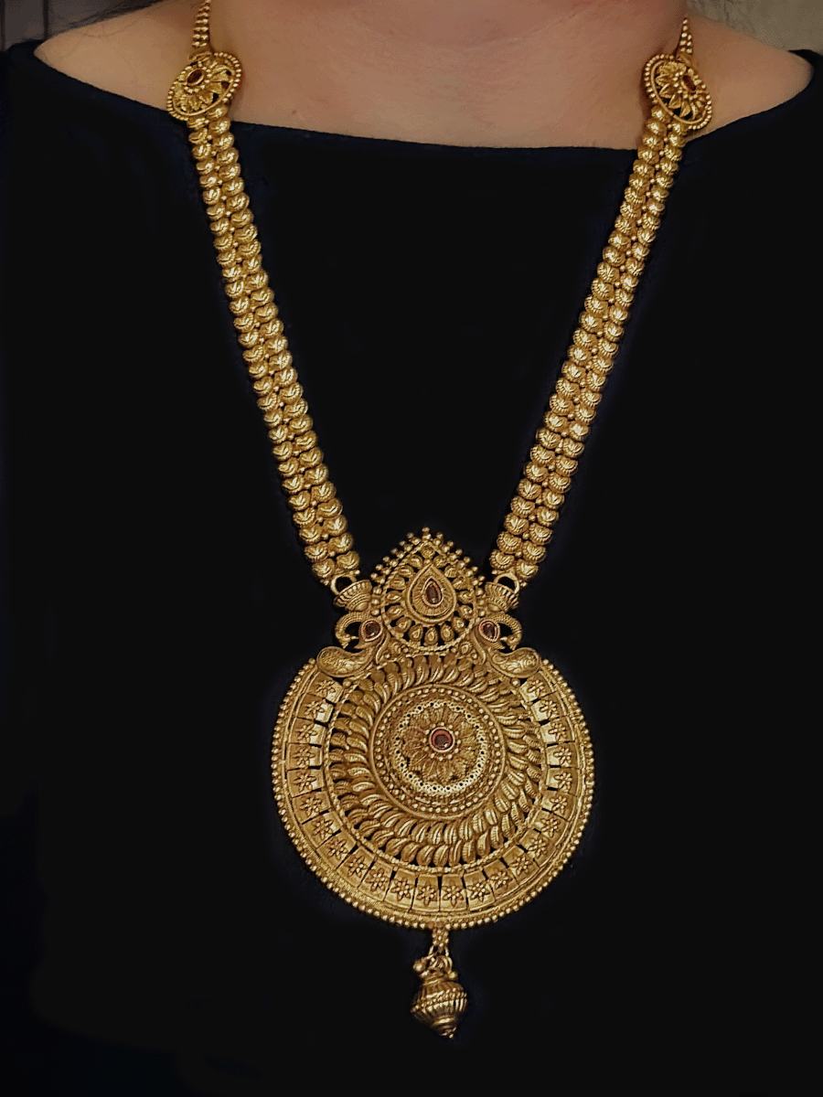 Circular pendant with paisley and ruby stone leaf top design long set