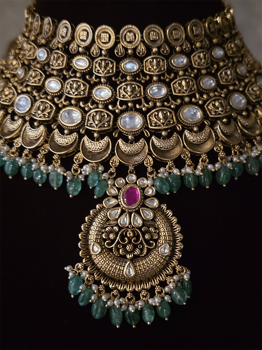 Antique gold finish kundan set with green drops broad set with chandbali  design tukdi in center