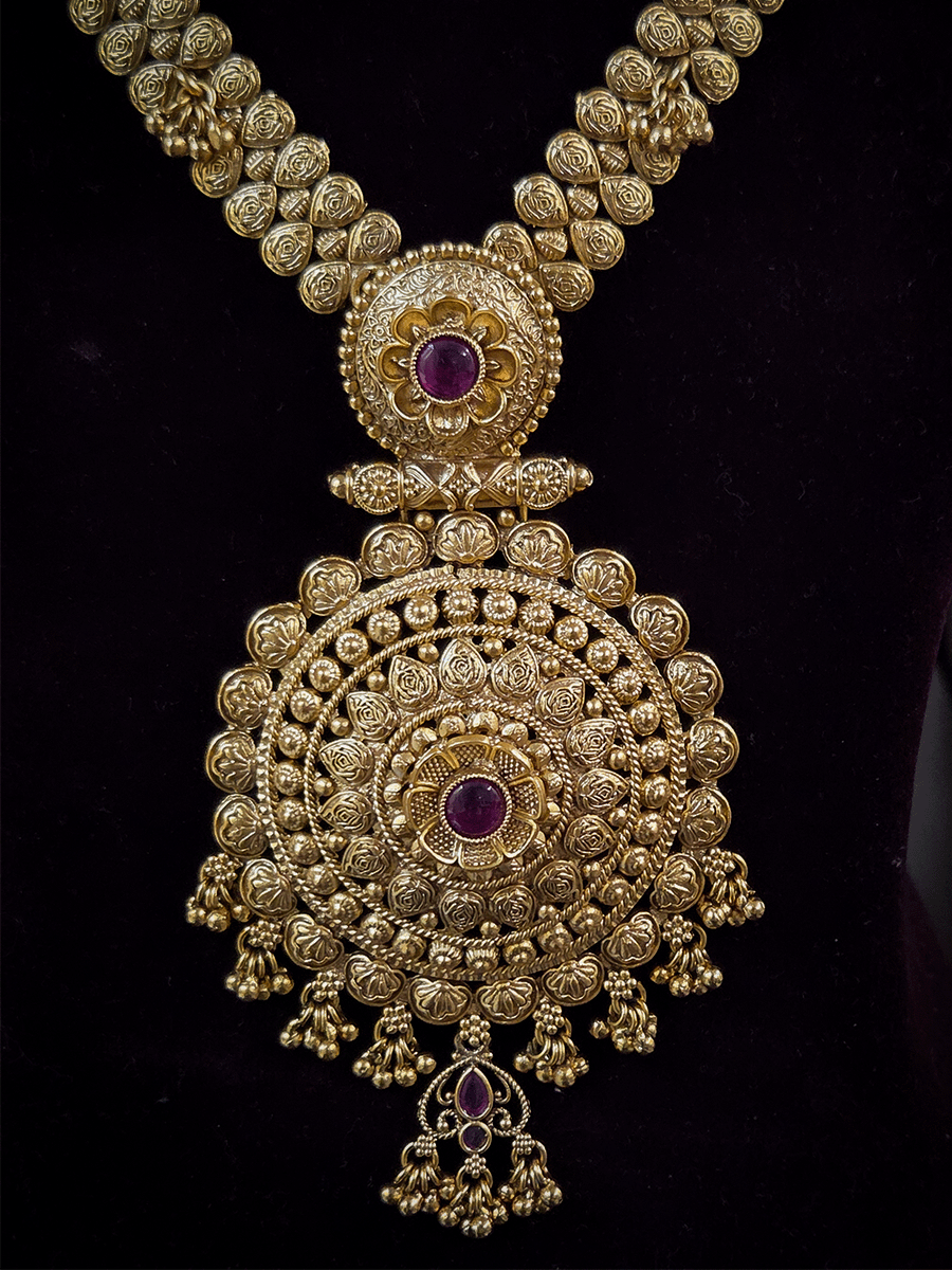 11 inch long leaf design side string with ghunghru hangings set with ruby stone flower design pendant