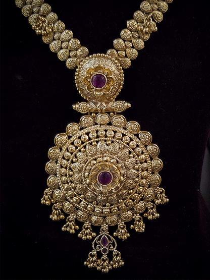 11 inch long leaf design side string with ghunghru hangings set with ruby stone flower design pendant
