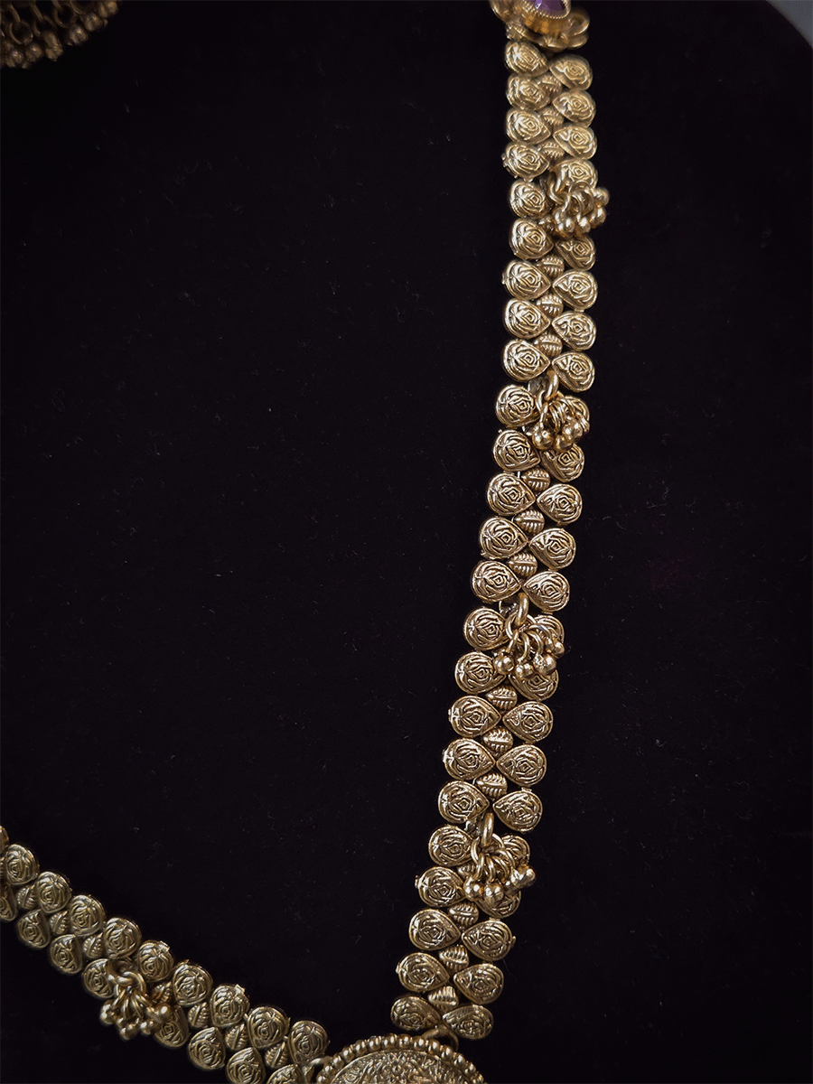 11 inch long leaf design side string with ghunghru hangings set with ruby stone flower design pendant