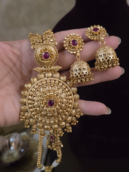 11 inch long leaf design side string with ghunghru hangings set with ruby stone flower design pendant