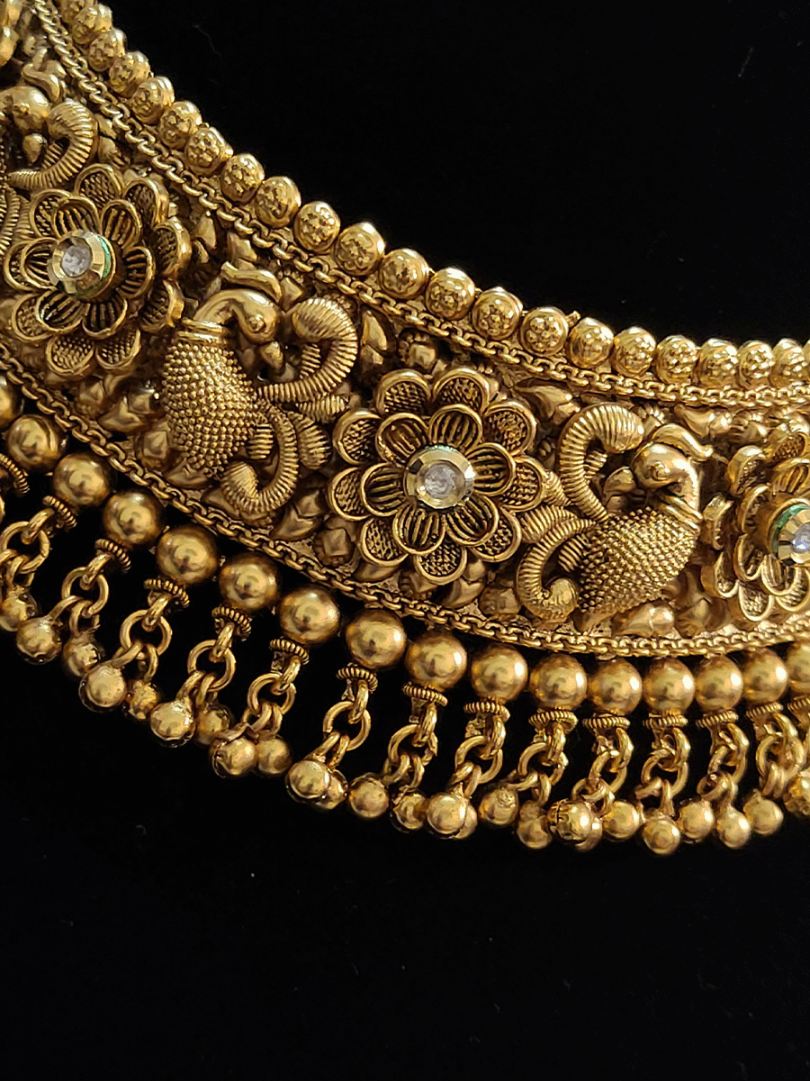 Intricate peacock and flower design with kundan choker setwith ghunghru hangings