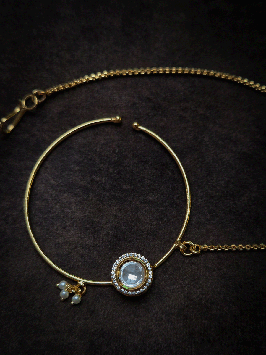 Round kundan with zircon detailing gold finish nath with pearly hangings