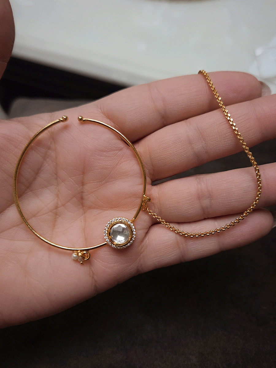 Round kundan with zircon detailing gold finish nath with pearly hangings