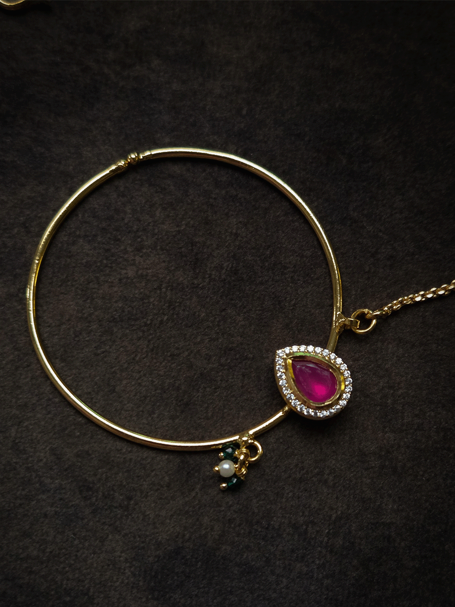 Tear drop ruby stone with zircon detailing gold ring 5cm diameter nath with bead hangings