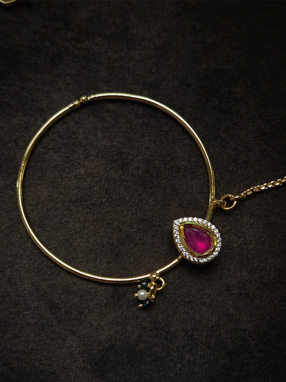 Tear drop ruby stone with zircon detailing gold ring 5cm diameter nath with bead hangings