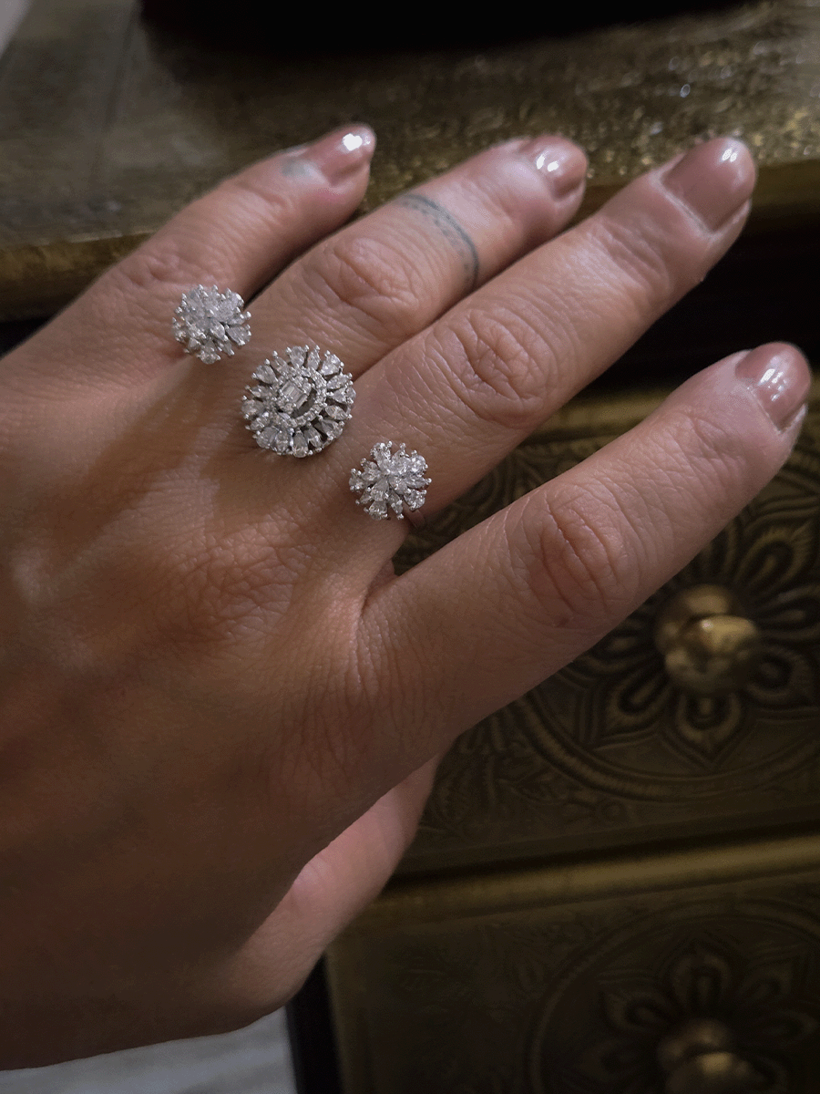 Double finger zircon studded three flower design adjustable ring