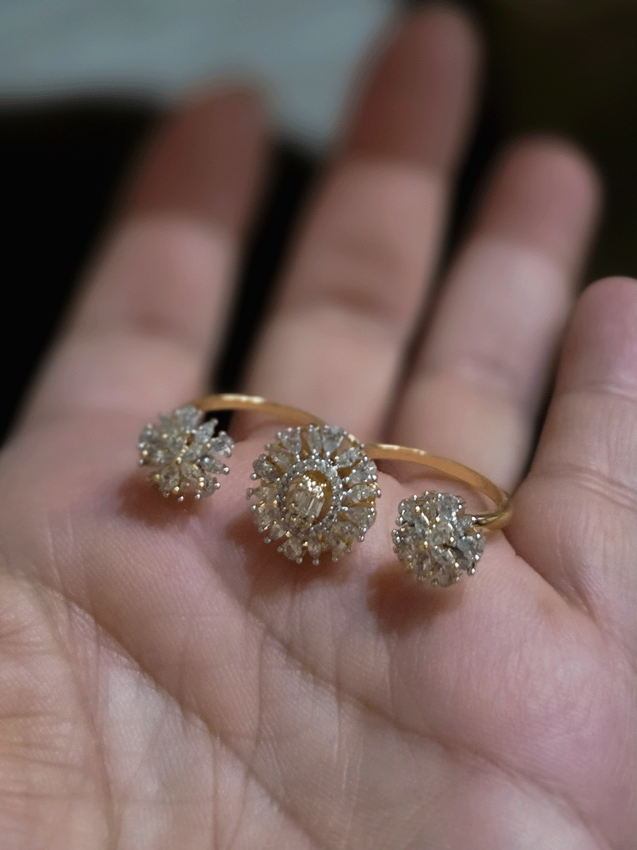 Double finger zircon studded three flower design adjustable ring