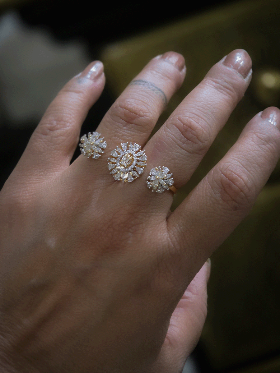 Double finger zircon studded three flower design adjustable ring