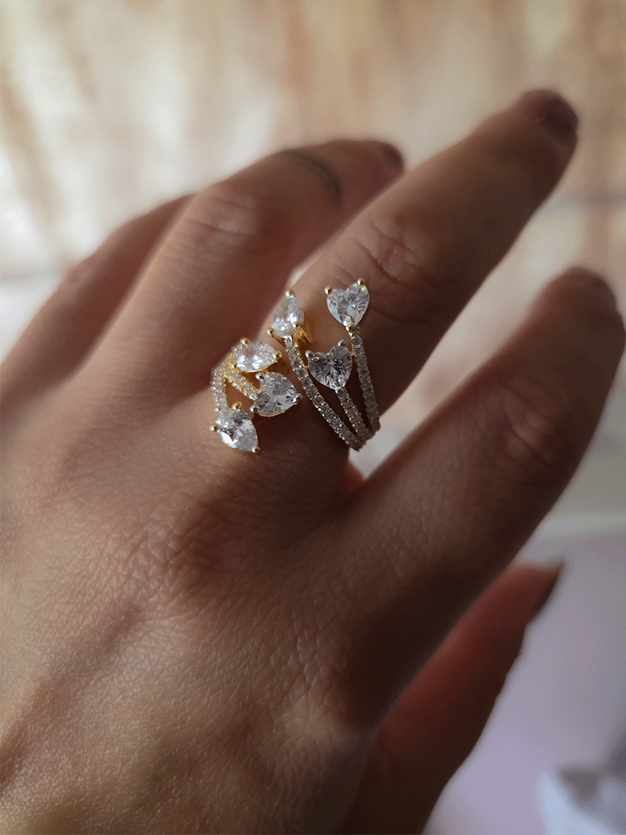 Zircon studded adjustable ring with heart and tear drop shaped white stones