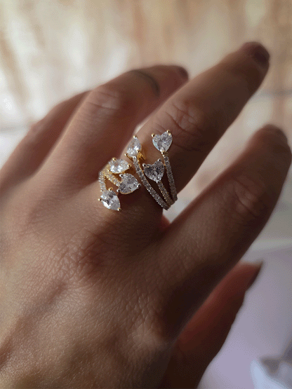 Zircon studded adjustable ring with heart and tear drop shaped white stones
