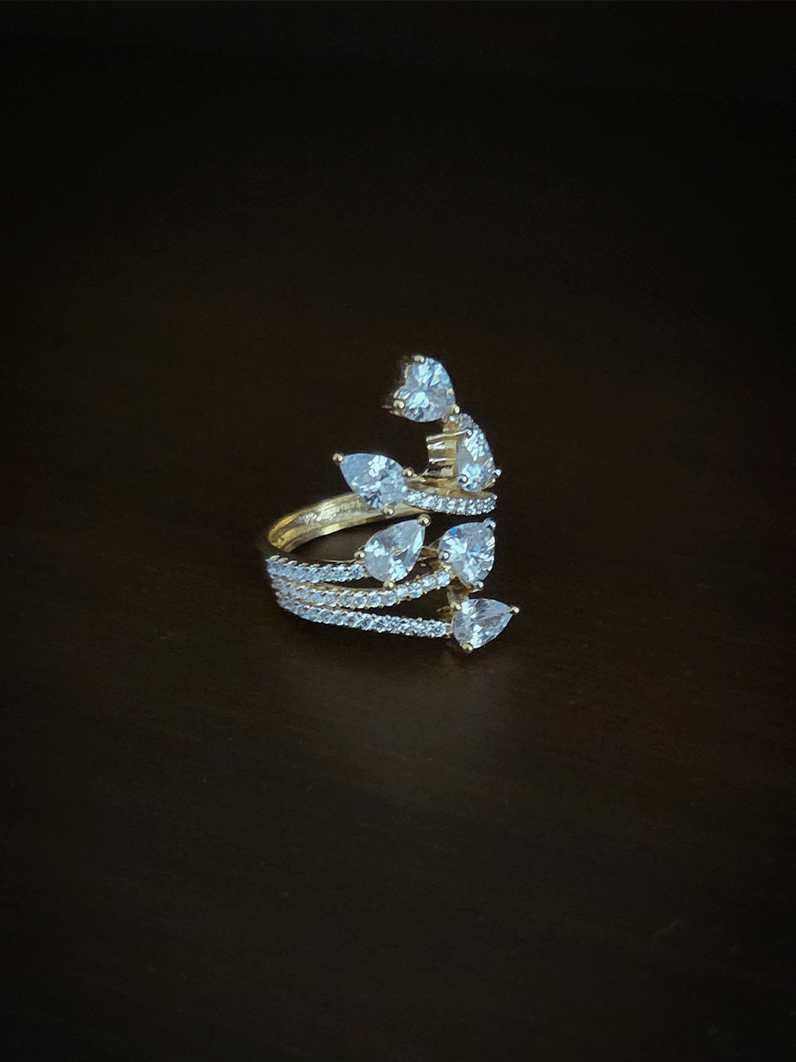 Zircon studded adjustable ring with heart and tear drop shaped white stones