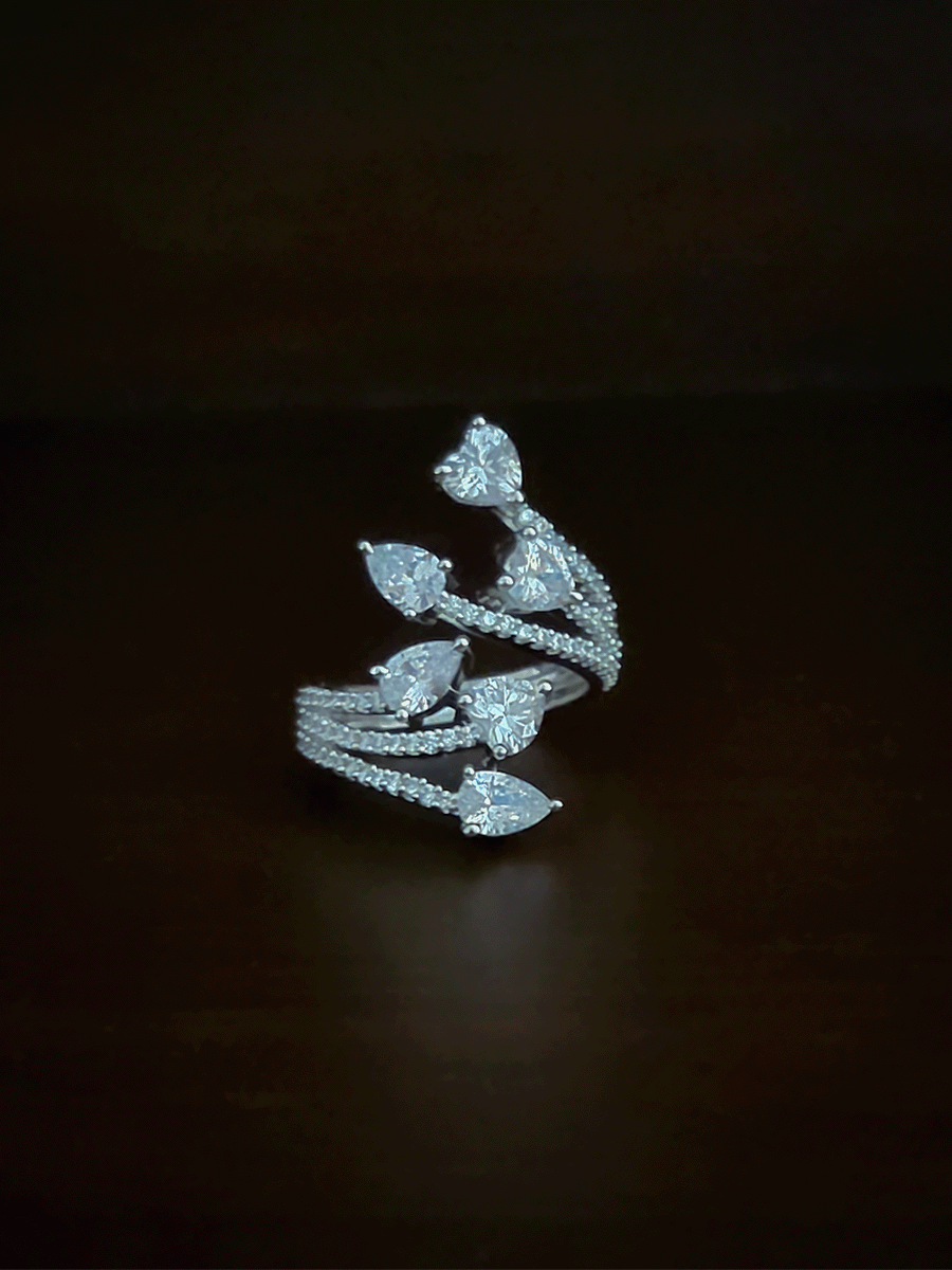 Zircon studded adjustable ring with heart and tear drop shaped white stones