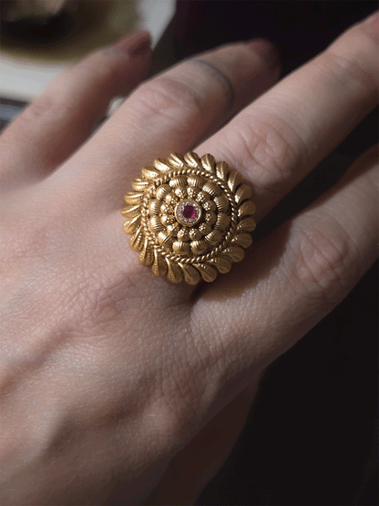 Circular gold bead design with ruby stone center adjustable ring