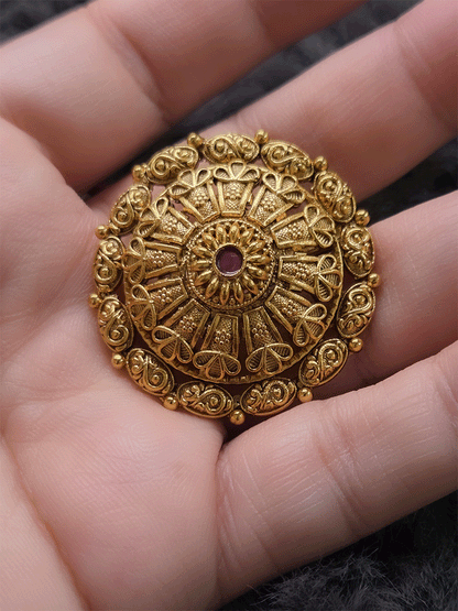 Flower design bold adjustable ring with ruby stone center and oval design outline