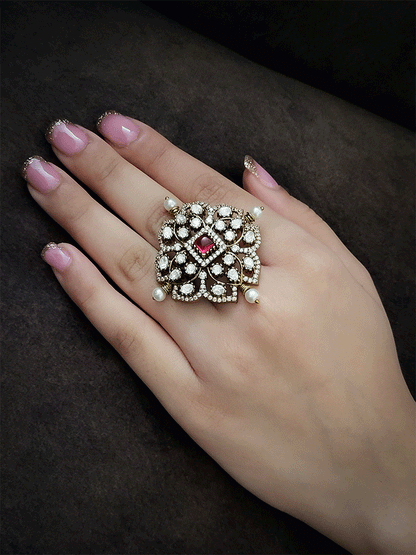 Coloured stone in center of adjustable victorian ring
