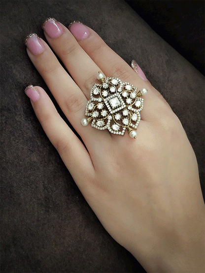 Coloured stone in center of adjustable victorian ring