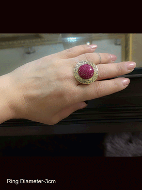 Circular openable ruby stones center antique gold finish ring