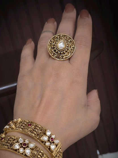 Round antique gold finish adjustable ring with tear drop kundan in center