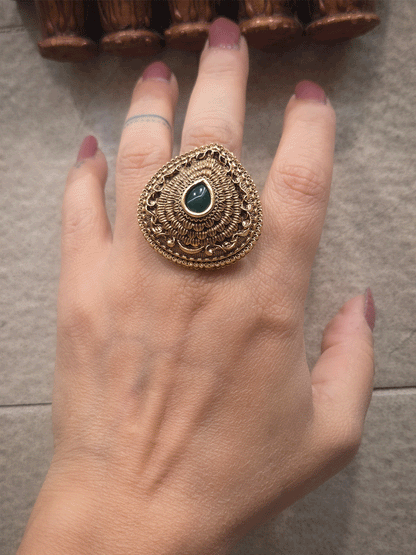 Antique gold finish openable self design leaf shaped tear drop center stone ring