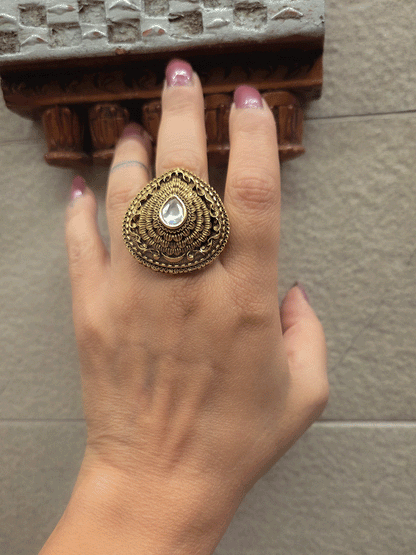 Antique gold finish openable self design leaf shaped tear drop center stone ring