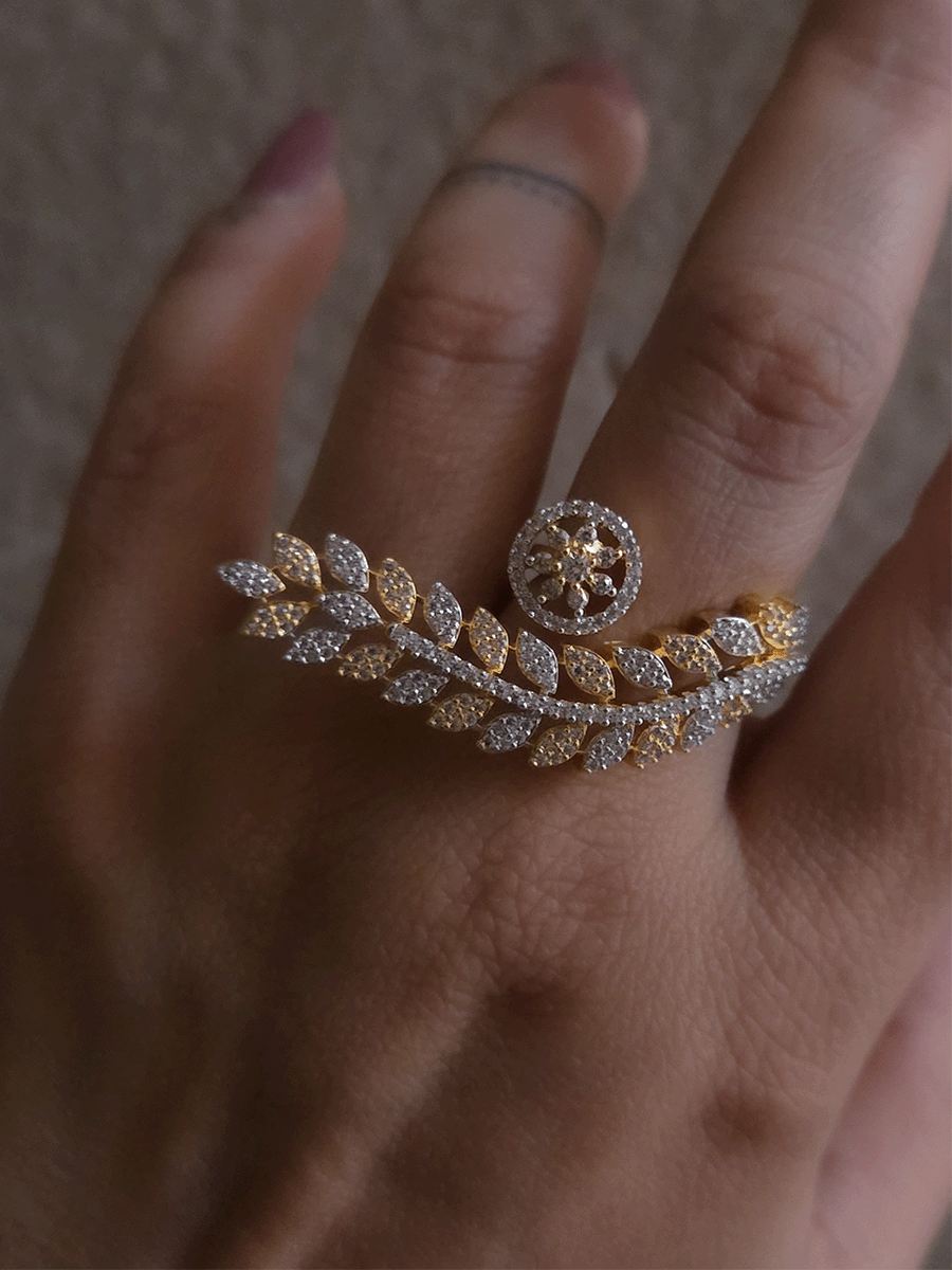 Gold and silver finish zircon studded long leaf on one end and circular on other end of openable ring