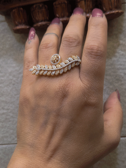 Gold and silver finish zircon studded long leaf on one end and circular on other end of openable ring
